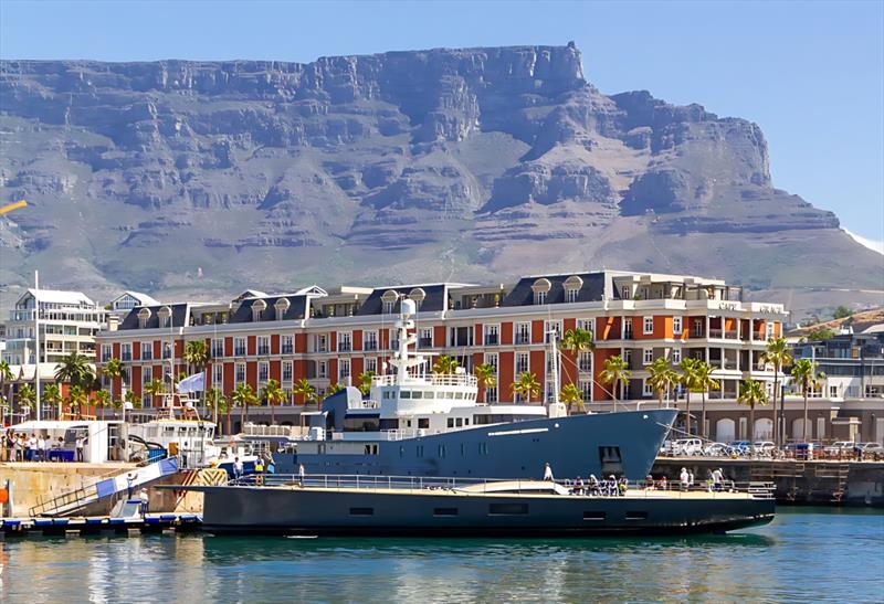 Luxury yacht in Cape Town harbor with Table Mountain